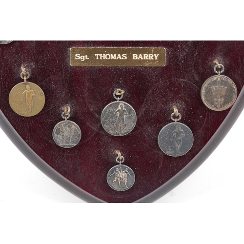 1404 - Collection of military interest athletics medals relating to Sergeant Thomas Barry arranged in a mah... 