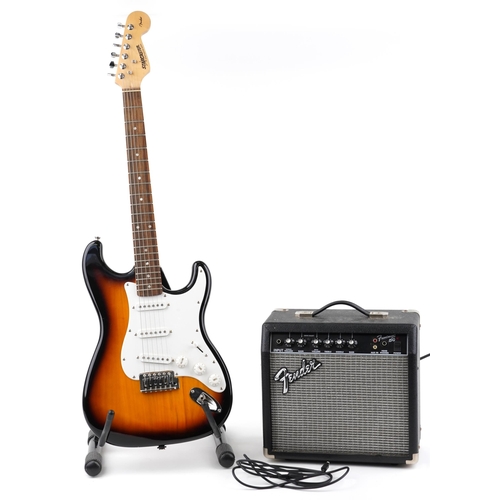 1005 - Starcaster by Fender six string electric guitar with Fender Front Man 15G amplifier and stand, the g... 