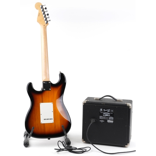 1005 - Starcaster by Fender six string electric guitar with Fender Front Man 15G amplifier and stand, the g... 