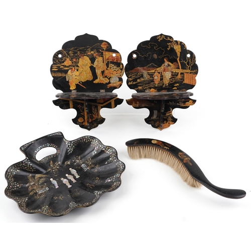 701 - Black lacquered and papier mache chinoiserie sundry items comprising a pair of folding wall brackets... 