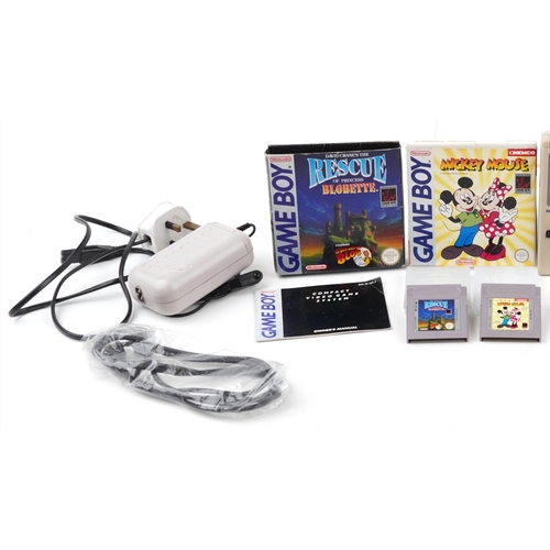 1175 - Vintage Nintendo Game Boy Advance with accessories and three games comprising Mickey Mouse, Super Ma... 