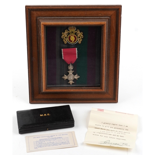 1372 - British military George V silver MBE housed in a glazed display with fitted case and letter from Buc... 