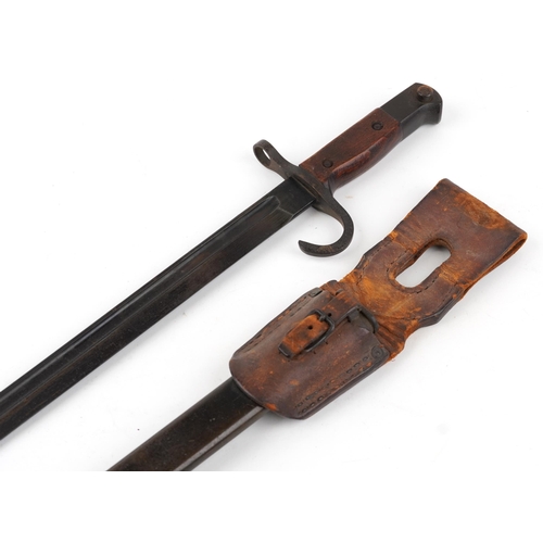 1416 - Military interest bayonet with scabbard and leather frog, 53cm in length