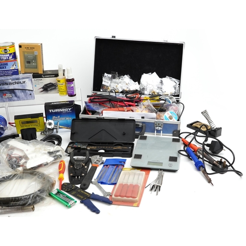 1245 - Collection of radio controlled mechanics and accessories including battery pack, Irvine engine, digi... 