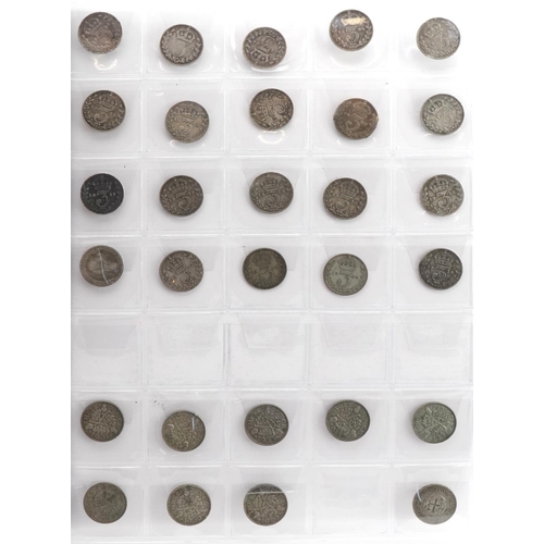 1598 - Victorian and later British coinage arranged in an album including silver threepenny bits, pennies a... 