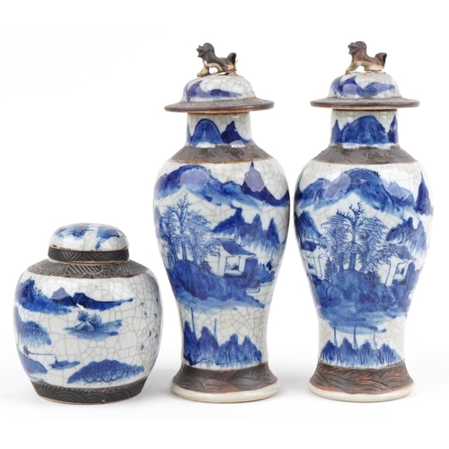 596 - Chinese blue and white crackle glaze porcelain including a pair of lidded baluster vases hand painte... 