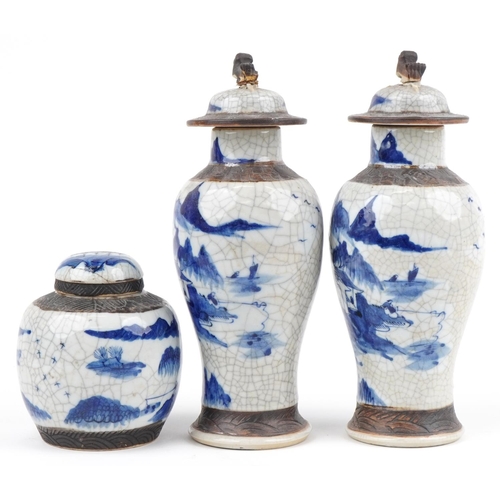 596 - Chinese blue and white crackle glaze porcelain including a pair of lidded baluster vases hand painte... 