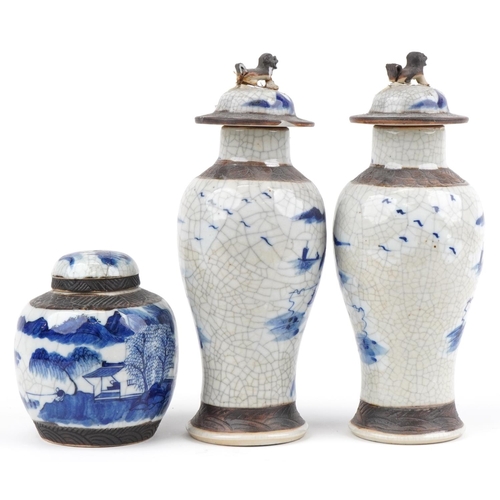 596 - Chinese blue and white crackle glaze porcelain including a pair of lidded baluster vases hand painte... 