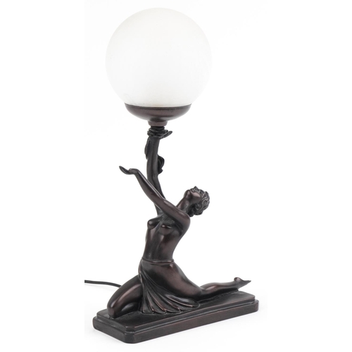 614 - Bronzed table lamp with frosted globular glass shade in the form of a semi nude Art Deco dancer, 38.... 