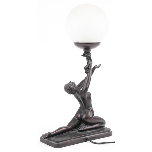 614 - Bronzed table lamp with frosted globular glass shade in the form of a semi nude Art Deco dancer, 38.... 