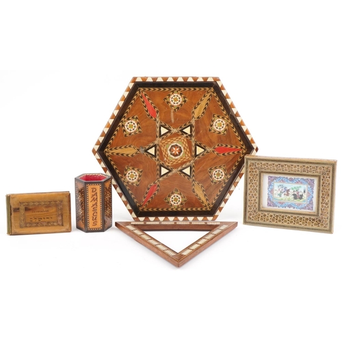 288 - Islamic woodenware including a vizagapatam style frame housing a panel housing a panel with polo pla... 