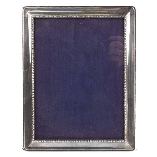 450 - Carrs, Elizabeth II rectangular silver easel photo frame, Sheffield 2000, 23.5cm x 18.5cm