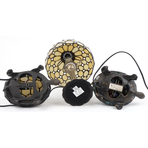 2676 - Three Tiffany design table lamps including two bronzed examples in the form of tortoises, the larges... 