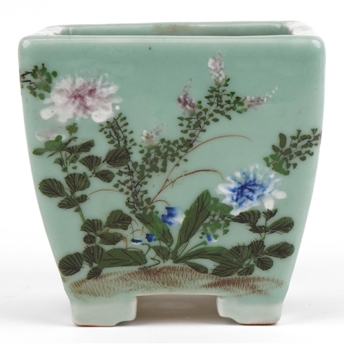 670 - Chinese porcelain celadon glazed four footed planter hand painted with flowers, 16.5cm high