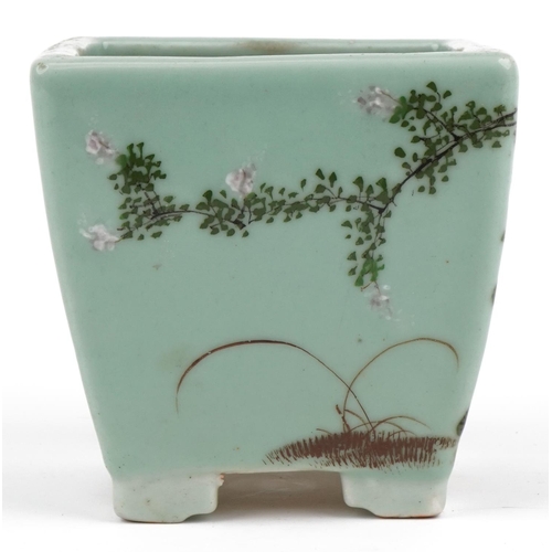 670 - Chinese porcelain celadon glazed four footed planter hand painted with flowers, 16.5cm high