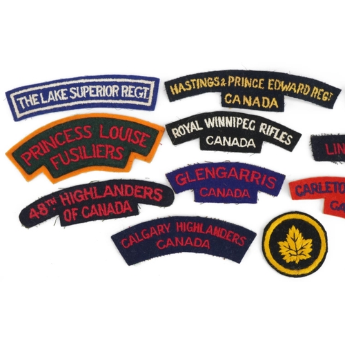 1378 - Ten Canadian military interest shoulder titles and cloth badge including Lincoln & Welland Regiment,... 