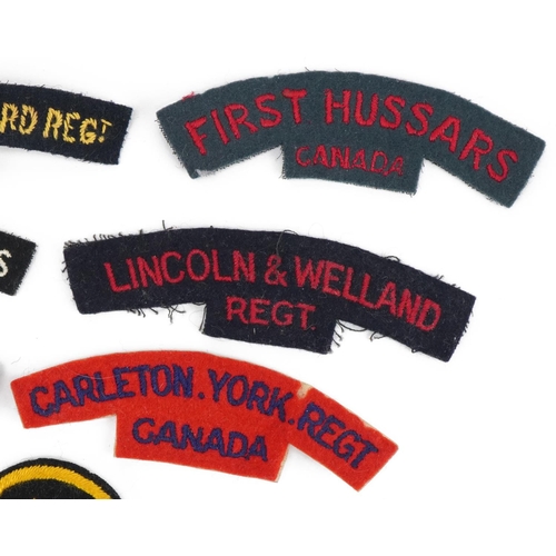 1378 - Ten Canadian military interest shoulder titles and cloth badge including Lincoln & Welland Regiment,... 