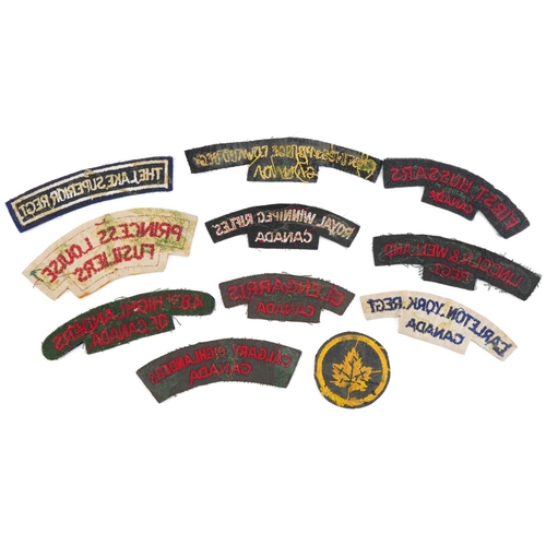 1378 - Ten Canadian military interest shoulder titles and cloth badge including Lincoln & Welland Regiment,... 