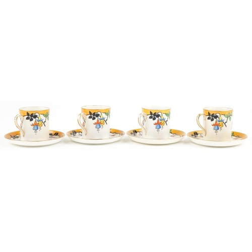 2511 - Four Foley china coffee cans with saucers decorated with stylised fruit, 6cm high