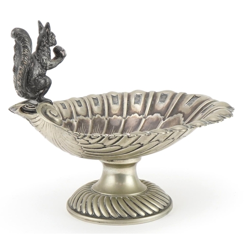 2711 - Silver plate shell design centre piece surmounted with a squirrel holding an acorn, 26.5cm in length