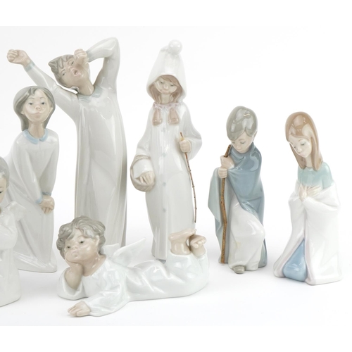 2257 - Eight Lladro angels and sleepy children including Morning Boy, the largest 21cm high