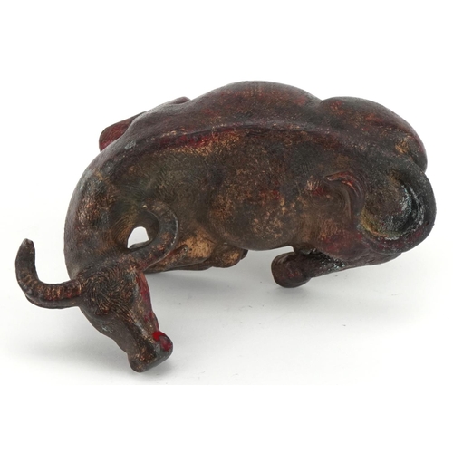 2632 - Chino Tibetan gilt and red lacquered bronze water buffalo, 19cm in length