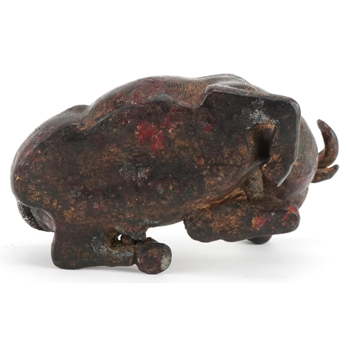 2632 - Chino Tibetan gilt and red lacquered bronze water buffalo, 19cm in length