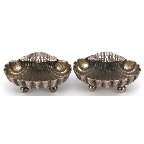 2648 - Pair of Victorian white metal shell shaped open salts, 5.5cm wide