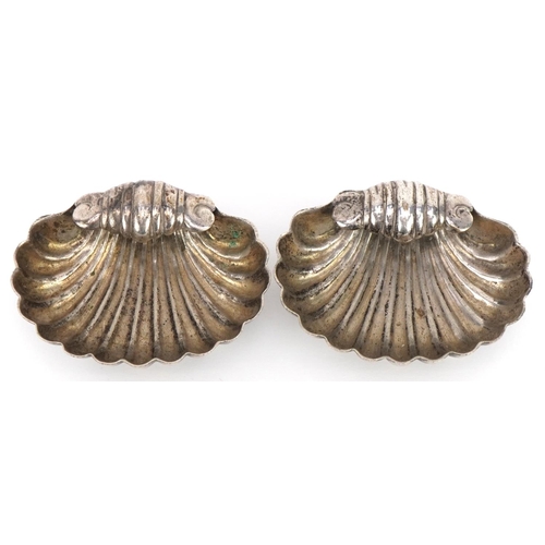 2648 - Pair of Victorian white metal shell shaped open salts, 5.5cm wide