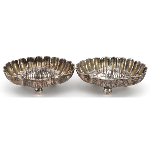 2648 - Pair of Victorian white metal shell shaped open salts, 5.5cm wide