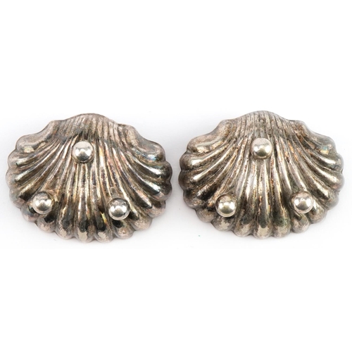 2648 - Pair of Victorian white metal shell shaped open salts, 5.5cm wide