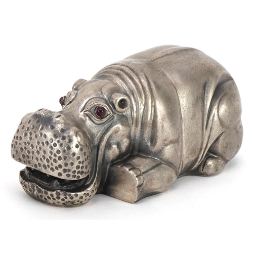 498 - Silver recumbent hippopotamus with cabochon ruby eyes, impressed Russian marks to the base, 7.5cm in... 