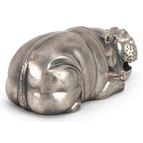 498 - Silver recumbent hippopotamus with cabochon ruby eyes, impressed Russian marks to the base, 7.5cm in... 