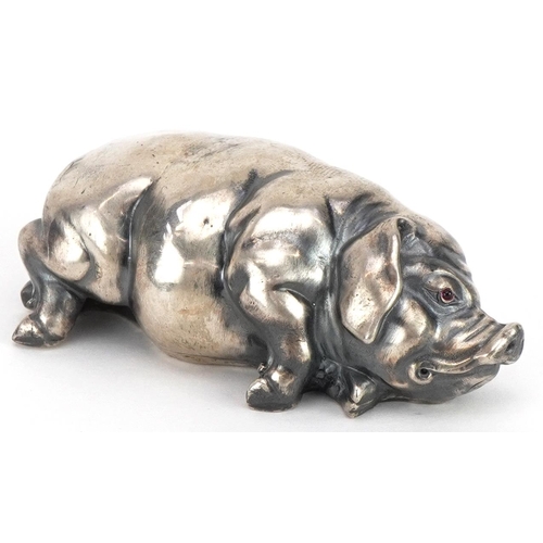 271 - Silver recumbent pig with cabochon ruby eyes, impressed Russian marks to the base, 7cm in length, 42... 