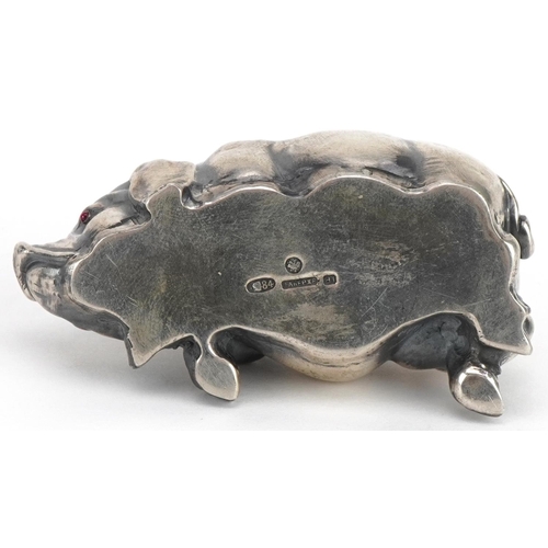 271 - Silver recumbent pig with cabochon ruby eyes, impressed Russian marks to the base, 7cm in length, 42... 