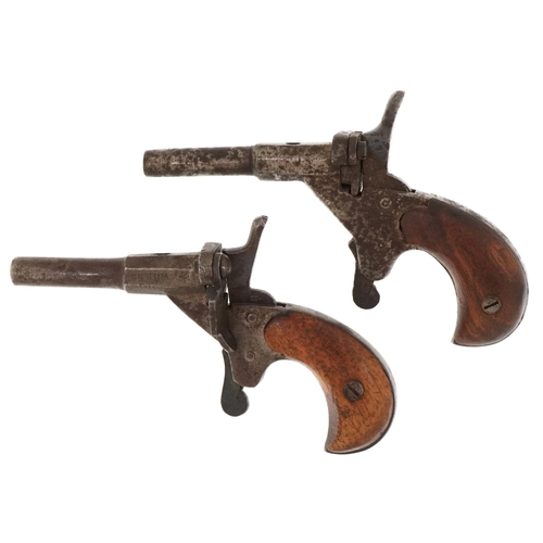 1435 - Two 19th century percussion cap muff pistols including one impressed Fritum, the largest 11cm wide