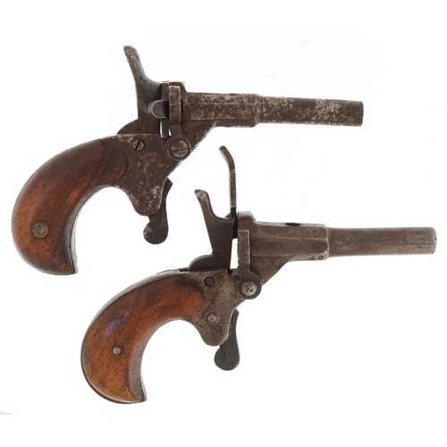 1435 - Two 19th century percussion cap muff pistols including one impressed Fritum, the largest 11cm wide