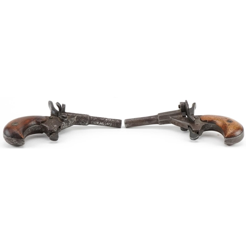 1435 - Two 19th century percussion cap muff pistols including one impressed Fritum, the largest 11cm wide