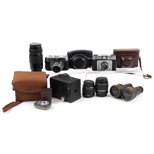 1066 - Vintage and later cameras, lenses and pair of leather bound binoculars, the lenses including Canon Z... 