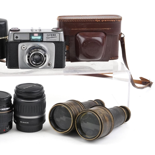 1066 - Vintage and later cameras, lenses and pair of leather bound binoculars, the lenses including Canon Z... 