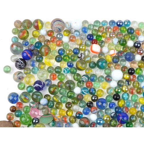 1186 - 19th century and later glass marbles including German swirl and milk glass examples