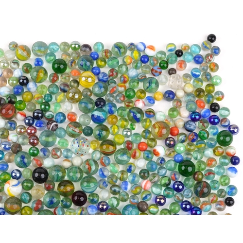 1186 - 19th century and later glass marbles including German swirl and milk glass examples