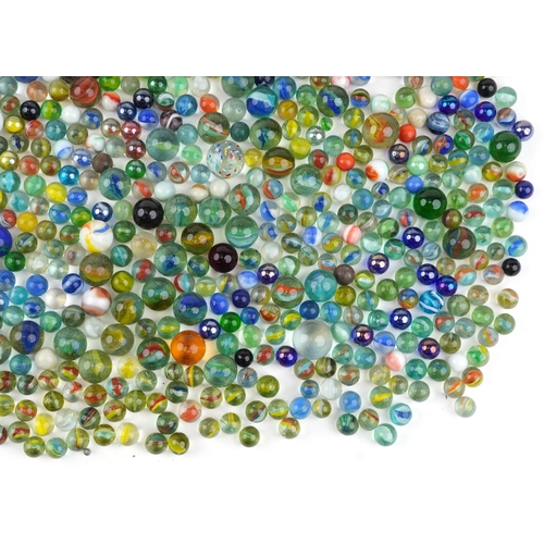 1186 - 19th century and later glass marbles including German swirl and milk glass examples