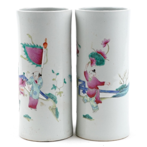 134 - Pair of Chinese porcelain cylindrical vases hand painted in the famille rose palette with a family p... 