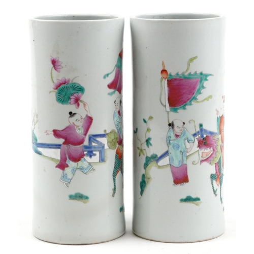 134 - Pair of Chinese porcelain cylindrical vases hand painted in the famille rose palette with a family p... 