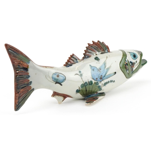 334 - Mid century Mexican pottery sculpture of a stylised fish hand painted with flowers, 40cm in length