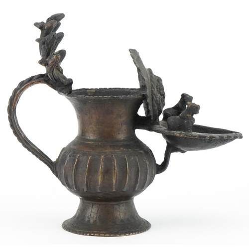 96 - Antique Nepalese bronze oil lamp, 18cm high