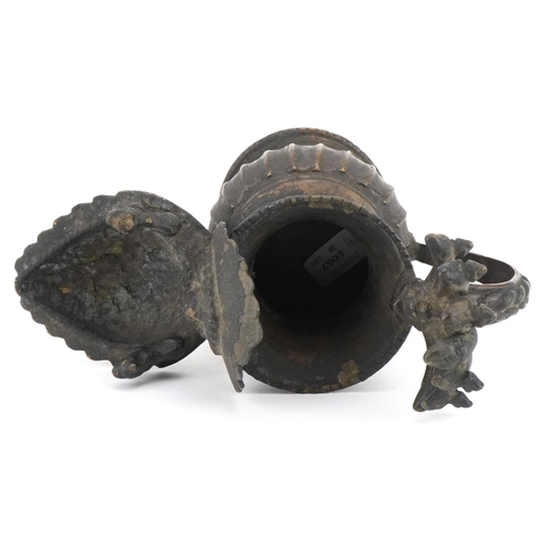 96 - Antique Nepalese bronze oil lamp, 18cm high