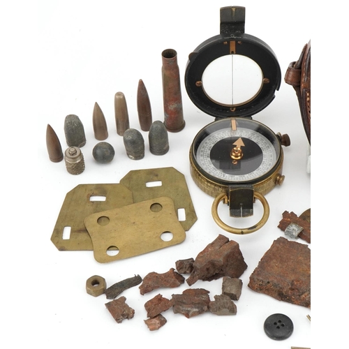 1400 - Militaria including two military issue compasses, one World War I Anglo-Swiss Association example wi... 