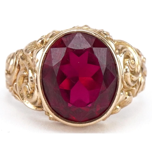 3075 - Large 9ct gold ruby solitaire ring with ornate cast setting, the ruby approximately 13.65mm x 11.70m... 